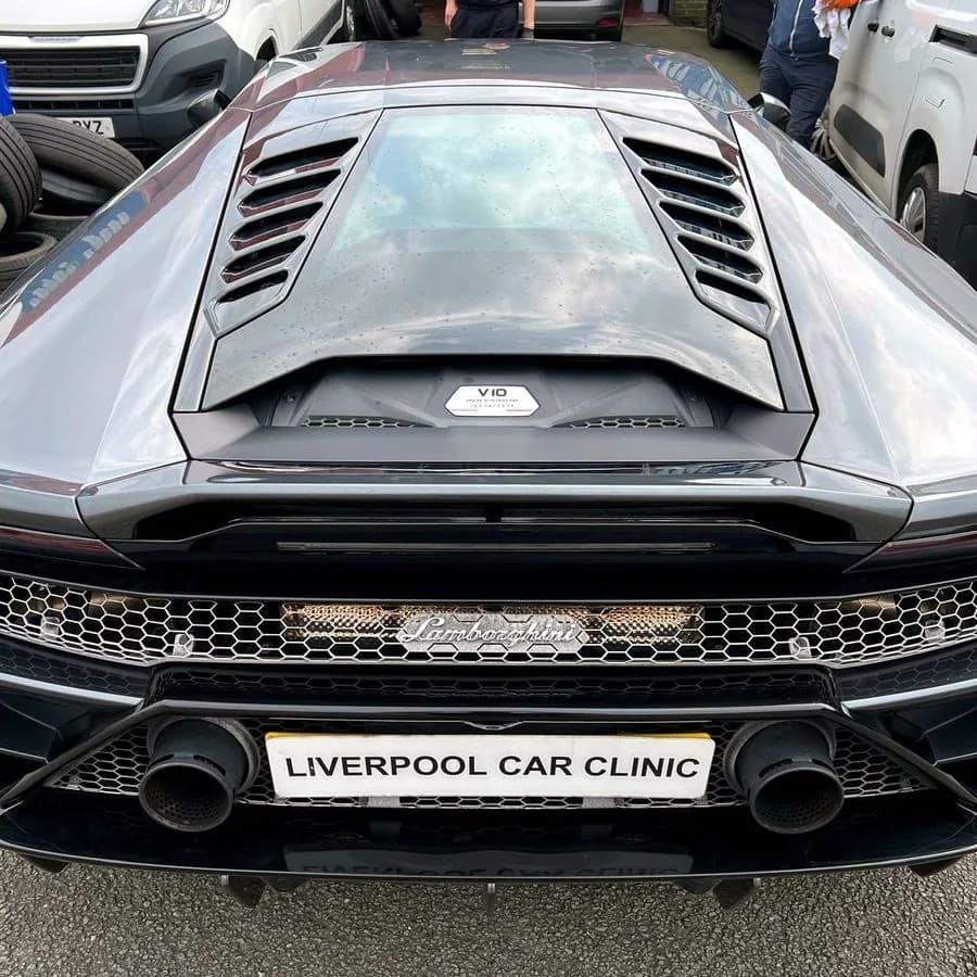 The rear of a Lamborghini Huracan carrying a Liverpool Car Clinic trade plate.