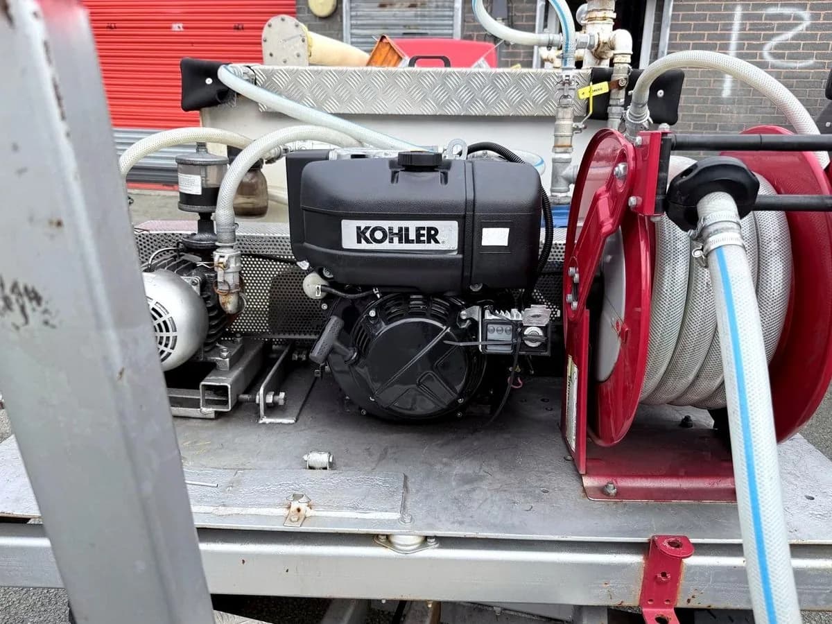 A Kohler engine and hose reel mounted on a specialist utility trailer of the type operated at Liverpool John Lennon Airport.